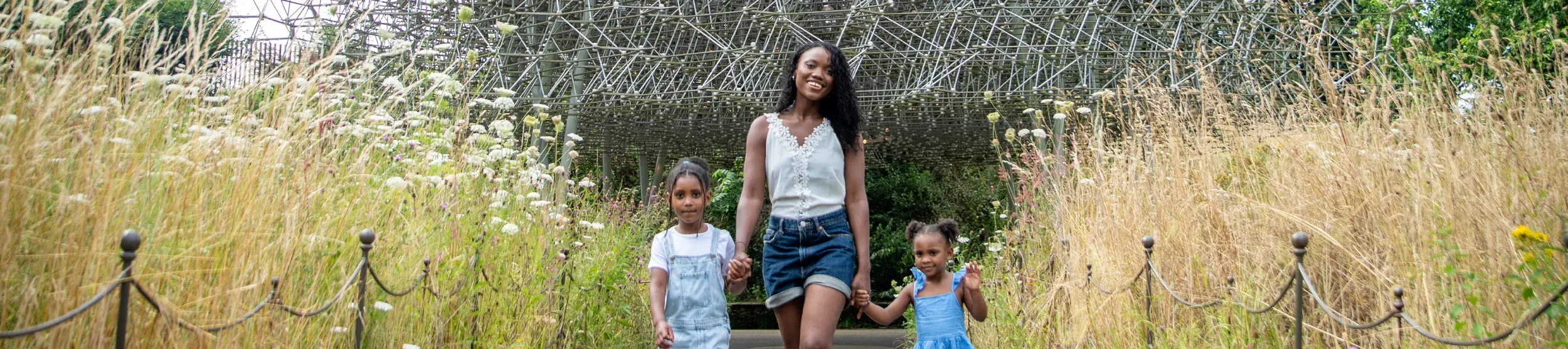 Family at the Hive Family walking down the path at the Hive