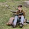 Natasha Ward sitting in a field with an open sketchbook