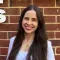 Claudia Pando in front of a brick wall