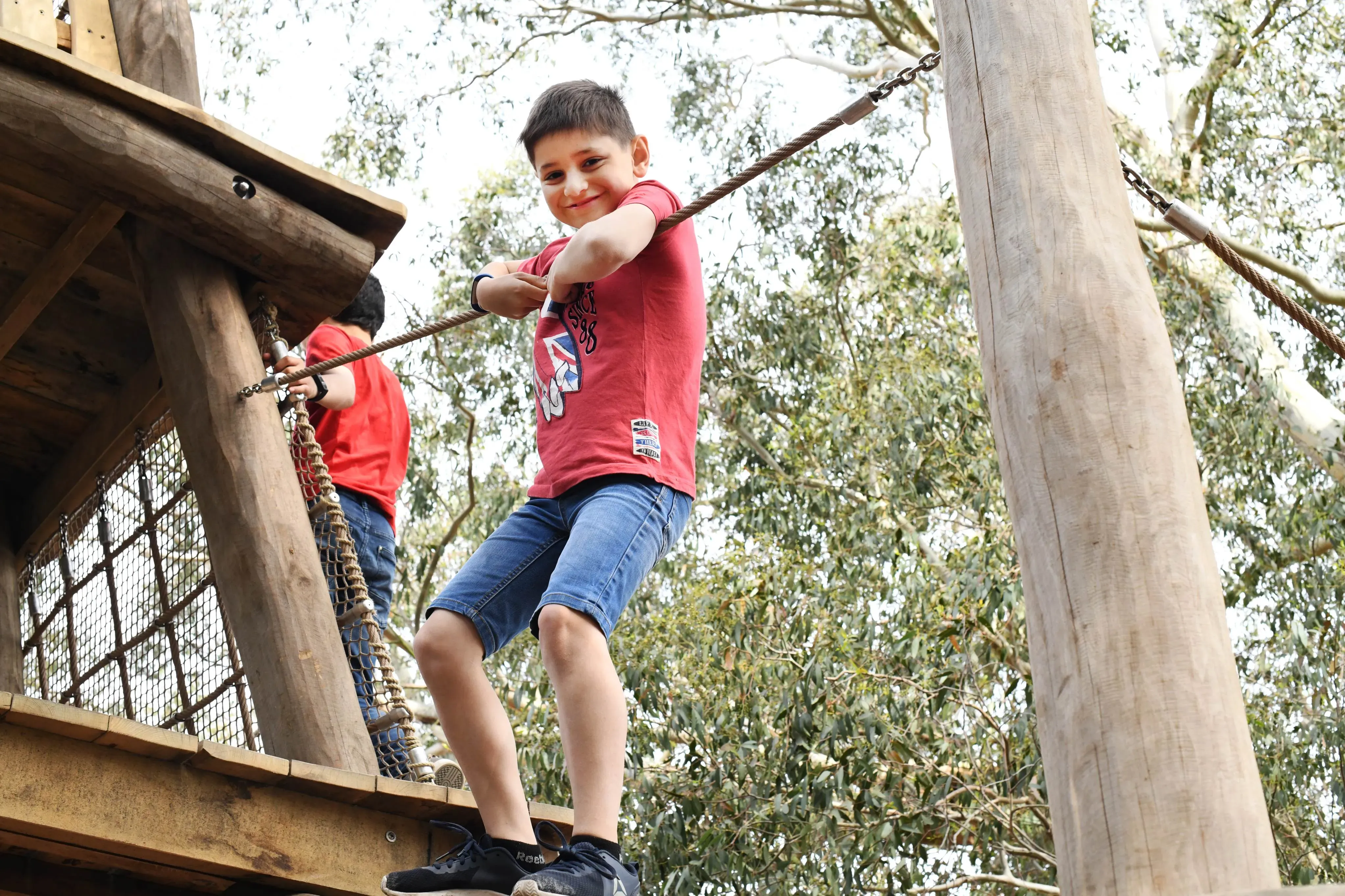 Boy playing in the Children's Garden, Ines Stuart-Davidson © RBG Kew Boy playing in the Children's Garden