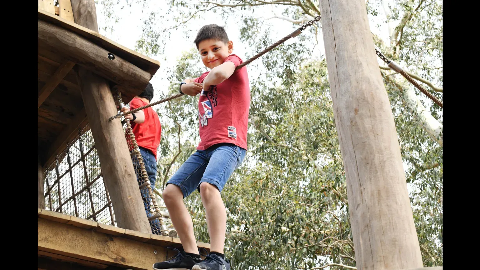 Boy playing in the Children's Garden, Ines Stuart-Davidson © RBG Kew Boy playing in the Children's Garden