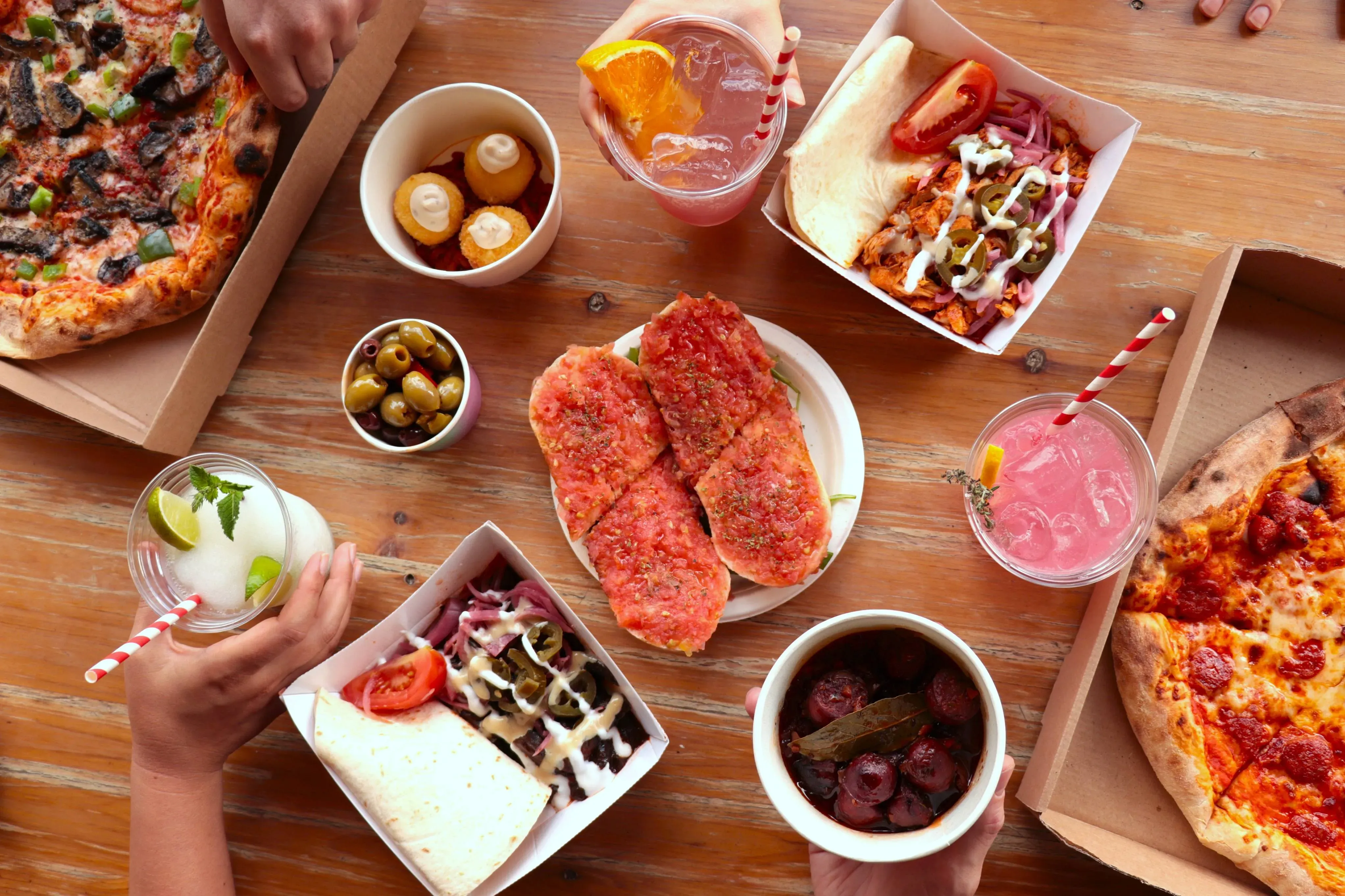 Food village © RBG Kew Pizza, shawarma and drinks on a table